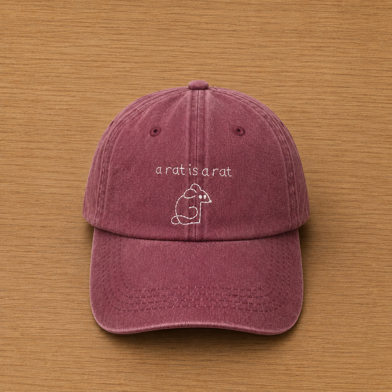 Gorra color granate con a rat is a rat bordado a mano