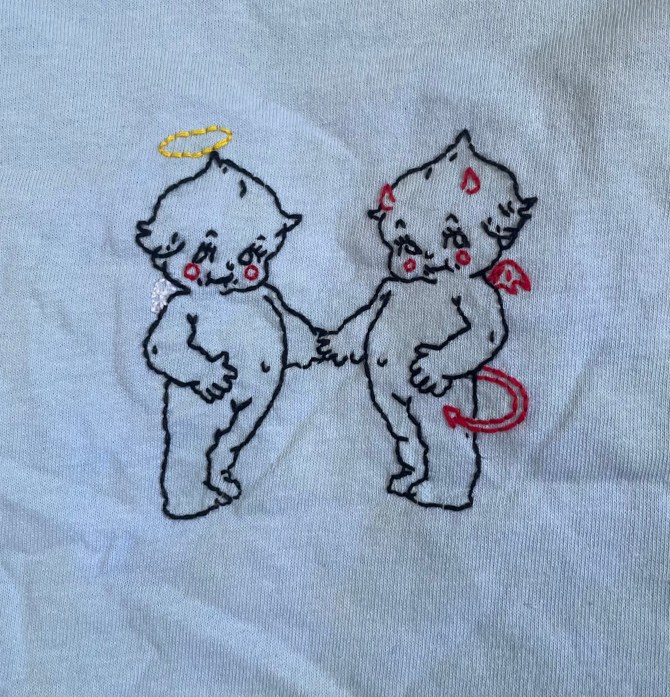 Camiseta con ángel y demonio