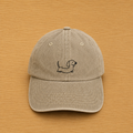 Sand-colored cap with hand-embroidered dachshund